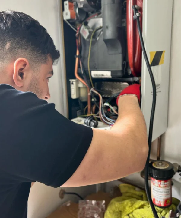 member of the team repairing the boiler